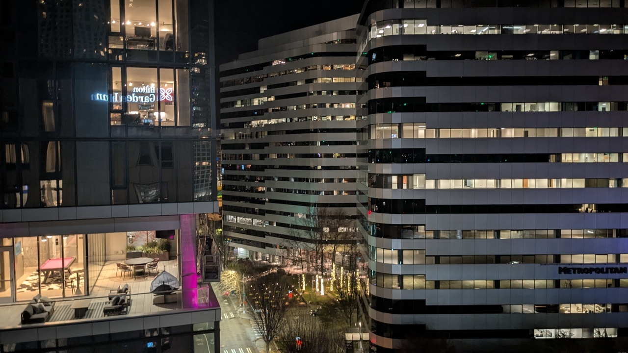 view from a hotel room during nighttime, looking down at buildings along a downtown street in Seattle