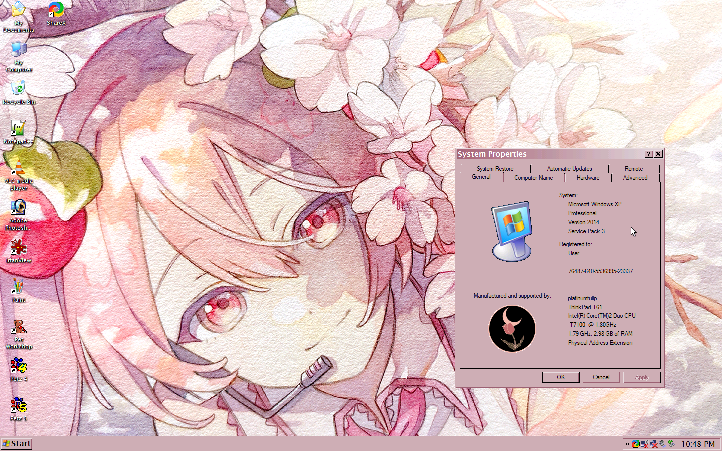 wallpaper of Sakura Miku, a girl with long, light pink hair tied up in pigtails, smiling around lots of cherry blossoms. a system properties window is open and there is a custom tulip logo on display