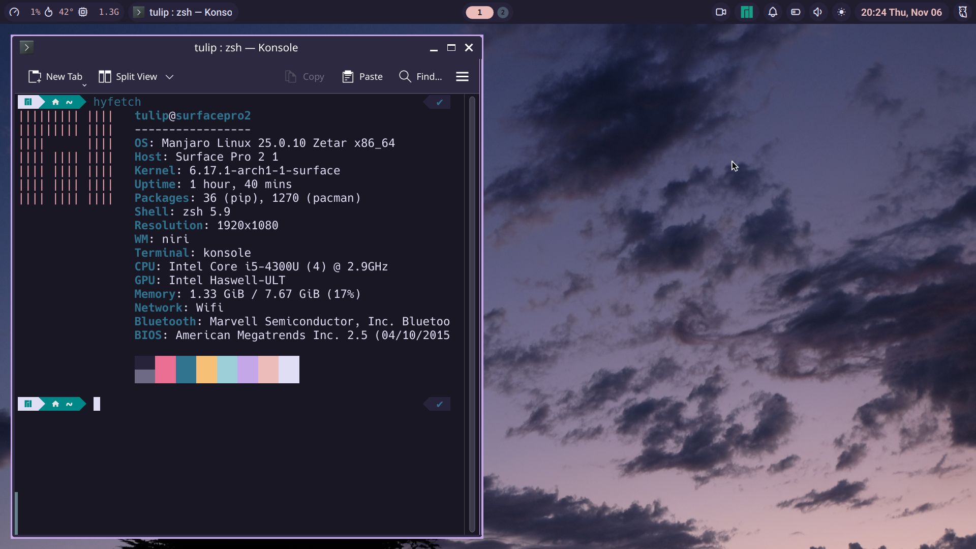 a Linux desktop with a dark purple color scheme, and a cloud background.